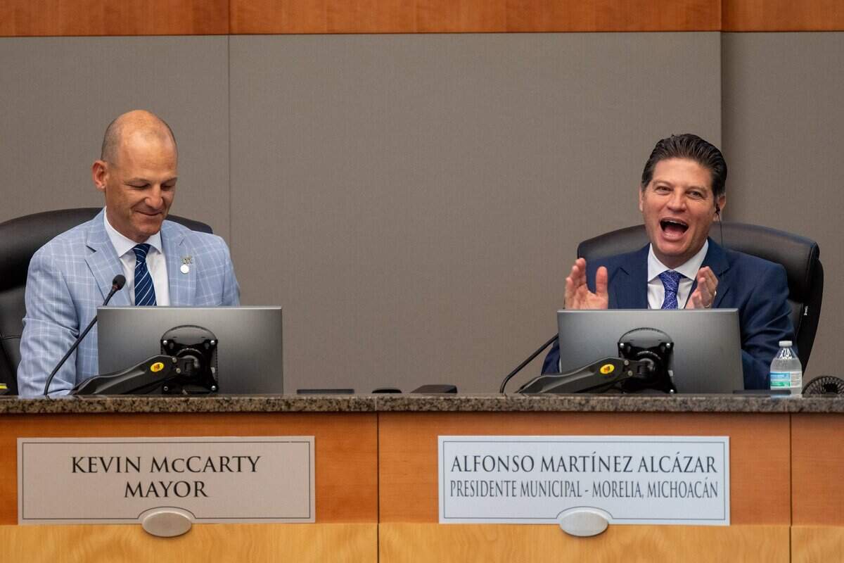 Alfonso Martínez Alcázar, the mayor of Morelia, Mexico, celebrates the signing of a sister city agreement with Sacramento Mayor Kevin McCarty at Sacramento City Hall on Thursday.