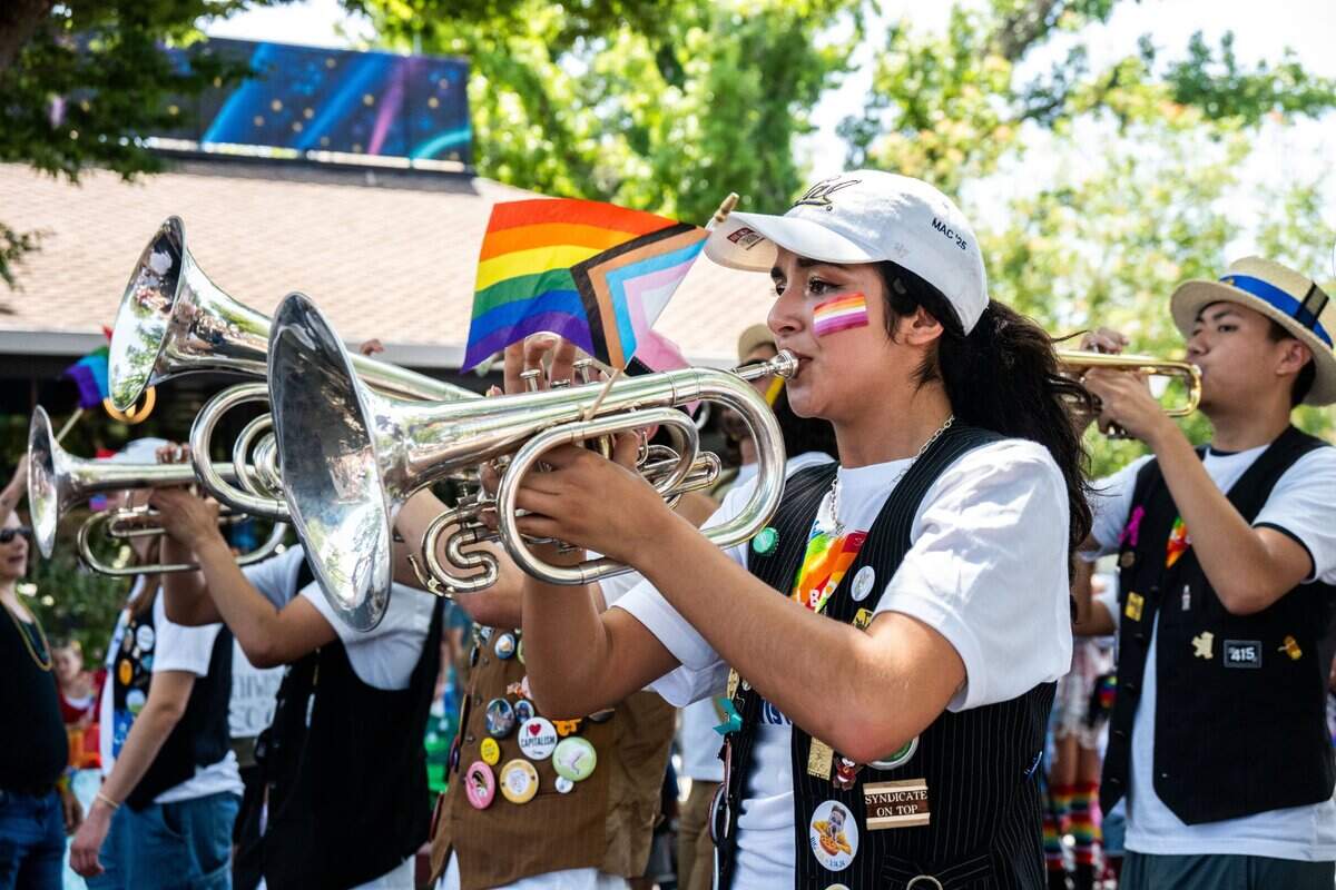 A member of the Cal band from UC Berkeley plays the trumpet at the Sacramento Pride March on June 15, 2025.