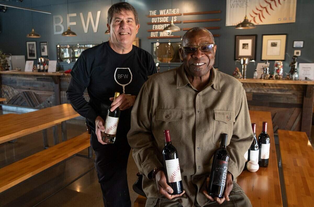 Local baseball great Dusty Baker, the manager for the Houston Astros – and former manager of the San Francisco Giants – who started his baseball career at Del Campo High School, sits with winemaker Chil Brenneman inside of the tasting room at the Baker Wine Family in West Sacramento on Friday, Dec. 10, 2021.
