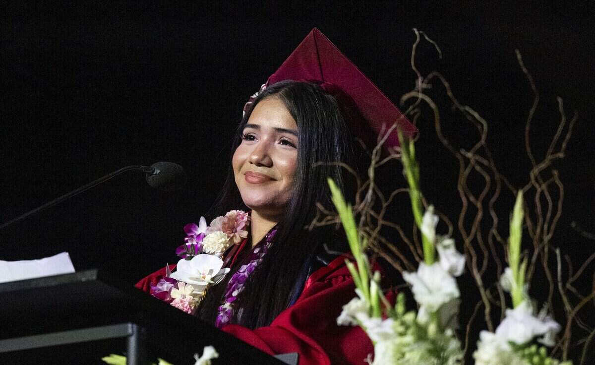 Graduate Greybis Lopez Guandique invites her parents to stand during her commencement speech as she thanks them for their support at C.K. McClatchy’s graduation ceremony at Golden 1 Center on Monday. It was the first time the Sacramento City Unified School District held ceremonies for its large high schools at the sports arena.