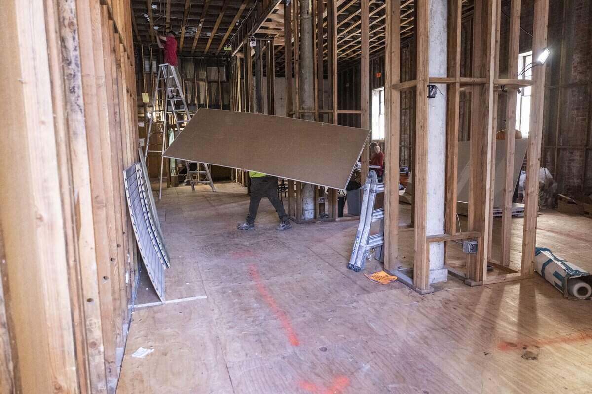 Workers rebuilt Evangeline’s Costume Mansion in March after a fire last June.