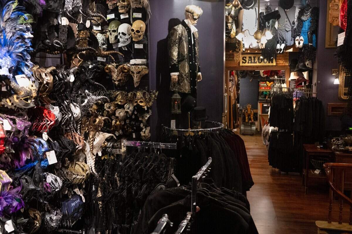 Masks and cloaks line the walls on the second floor of Evangeline’s Costume Mansion in Old Sacramento. The store celebrated its grand reopening on Friday, June 26, 2026, after being closed for just over a year due to fire damage.