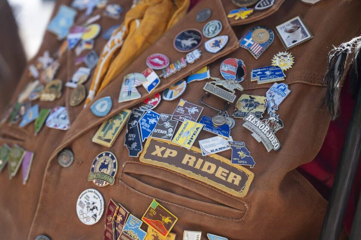 Various pins are showcased on National Pony Express Association member Pam Dixon-Simons’ vest on Thursday, June 25, 2026, in Old Sacramento — the last stop of the group's annual ten-day ride across the United States reenacting the historic Pony Express.