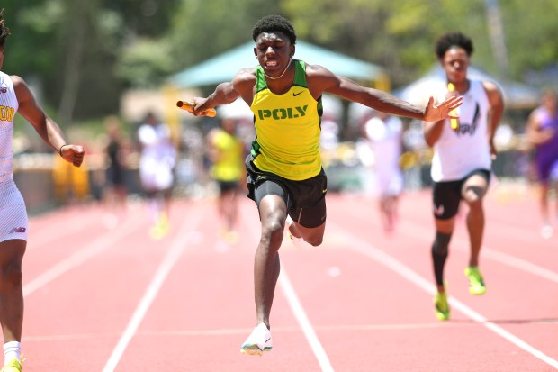 Long Beach Poly's Jaydin Lawrence anchors his team in the Division 1 boys 4x100-meter relay at the CIF Southern Section Track and Field Finals at Moorpark High School on Saturday, May 16, 2026.(Photo by Andy Holzman, Contributing Photographer)
