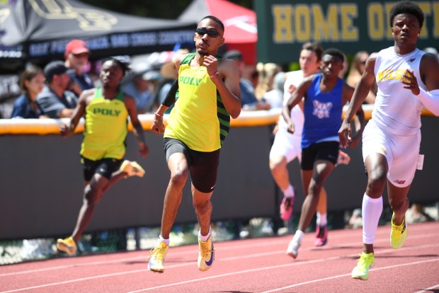 Long Beach Poly's Noah Smith and Wilson's Kaedyn Burroughs compete in the Division 1 boys 400-meter dash at the CIF Southern Section Track and Field Finals at Moorpark High School on Saturday, May 16, 2026.(Photo by Andy Holzman, Contributing Photographer)