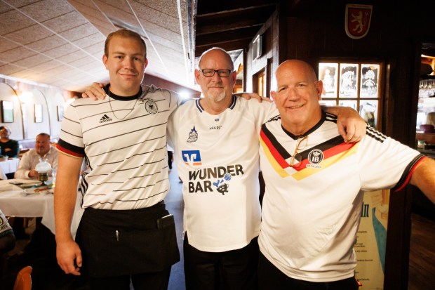Teske's Germania co-owners and brothers Greg Baumann, center, and Scott Baumann, right, and Scott's son and waiter Jacob Baumann, are pictured during a World Cup watch party at Teske's Germania in San Jose, Calif. (Dai Sugano/Bay Area News Group)