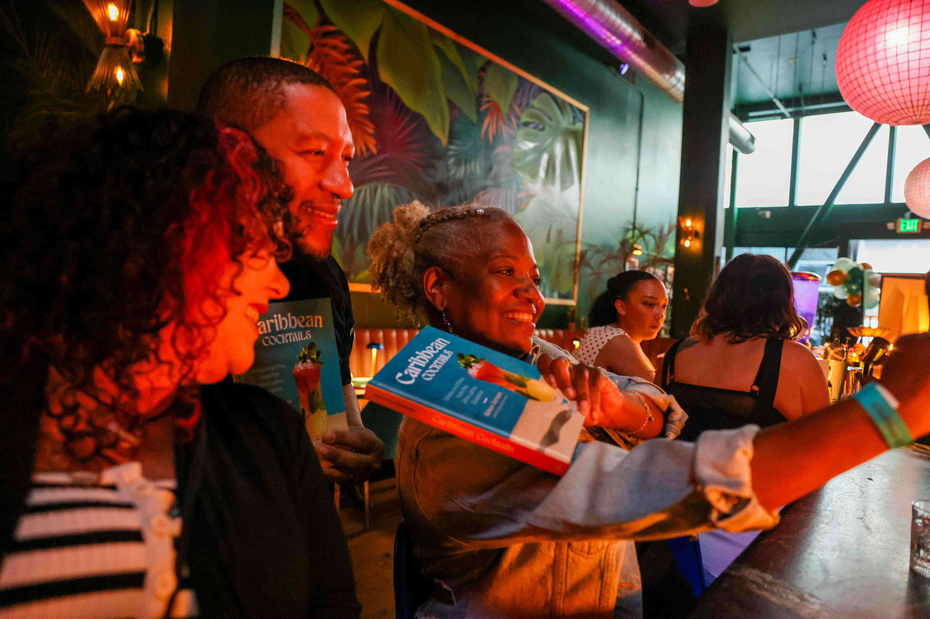 Nelson German, the chef-owner of Sobre Mesa and alaMar, center,...