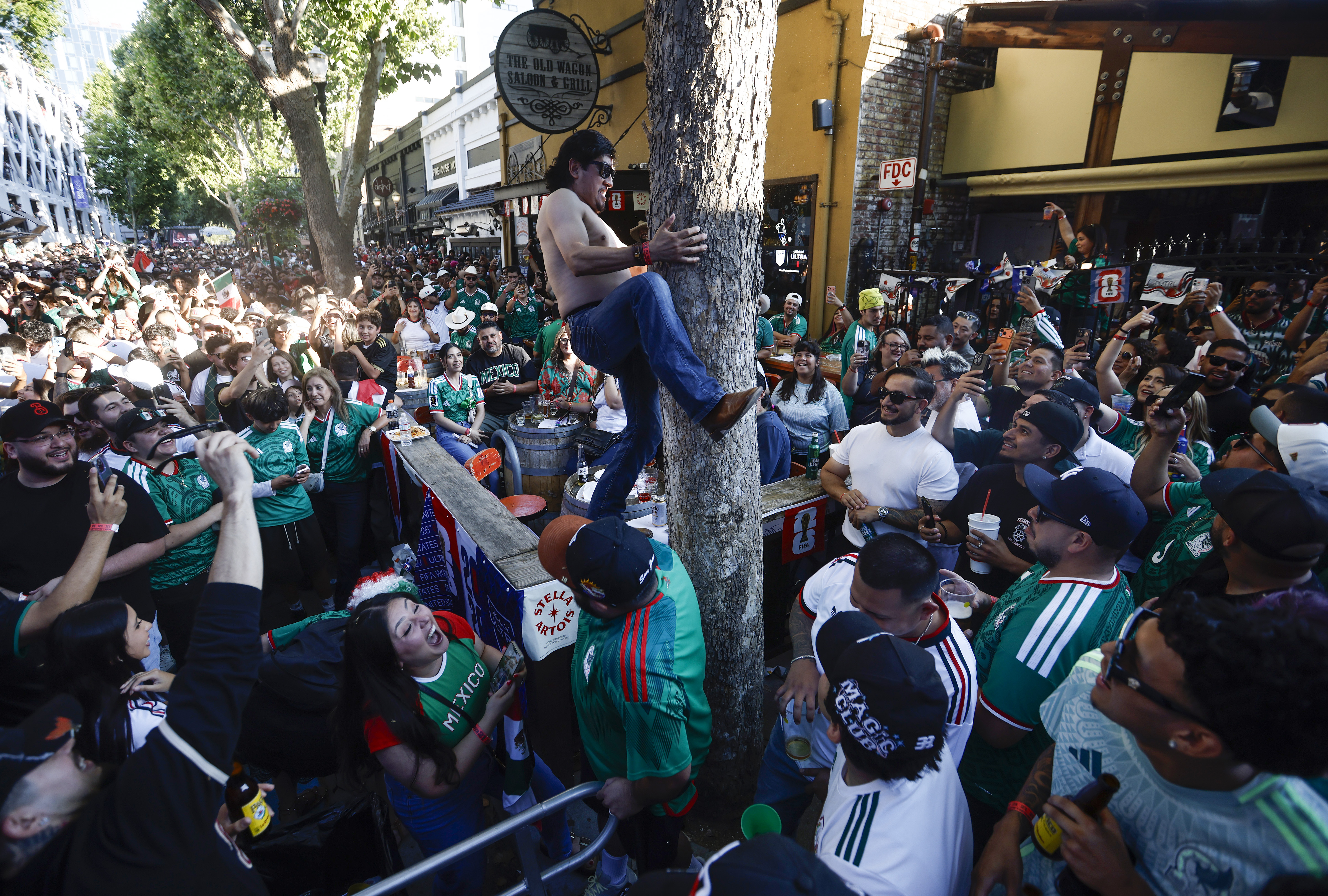 Mexico soccer fans celebrate a goal by Mexico in the...