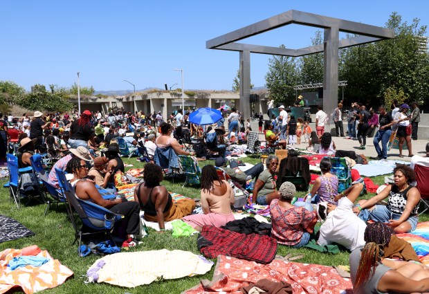 People gather on the lawn during the Oakland Museum of California's Hella Juneteenth Festival 2025 in Oakland on Thursday, June 19, 2025. (Jane Tyska/Bay Area News Group)