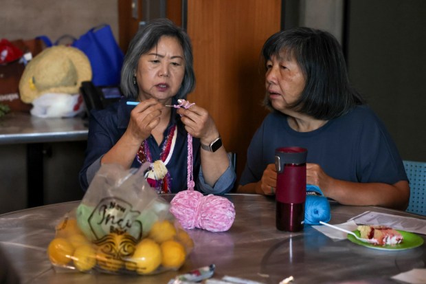 Kim Vu, of San Jose, left, learns how to knit at Seven Trees Community Center in San Jose, Calif., on Thursday, June 18, 2026. (Shae Hammond/Bay Area News Group)