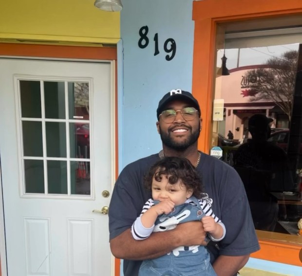 Darren Preston, pictured with his daughter, stands in front Malibu's Burgers' San Rafael location. (Courtesy of Darren Preston)