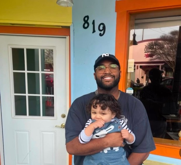 Darren Preston, pictured with his daughter, stands in front Malibu's Burgers' San Rafael location. (Courtesy of Darren Preston)