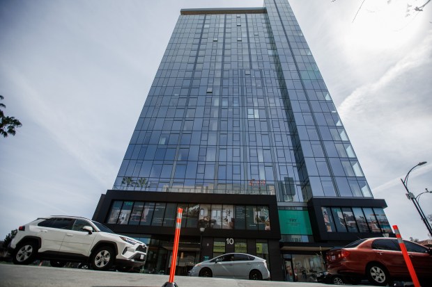 Cars travel past The Fay apartment building March 26, 2026, in downtown San Jose. (Dai Sugano/Bay Area News Group)