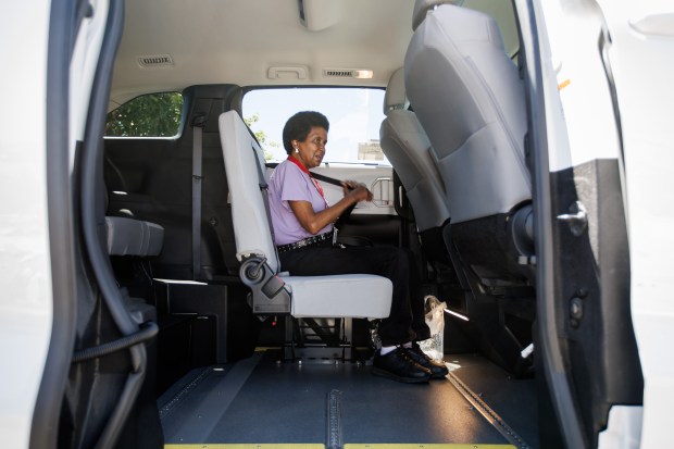 Crystal Calhoun, 69, of San Jose fastens her seatbelt inside a VTA ACCESS vehicle to head to her work at Levi's Stadium for the World Cup, Friday, June 19, 2026. (Dai Sugano/Bay Area News Group)