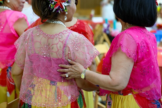 FilCal Heritage dancers line up for food during a celebration of Philippine Independence Day at City Hall in downtown San Jose, Calif., on Friday, June 12, 2026. (Shae Hammond/Bay Area News Group)