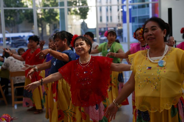 Lerma Garcia, of San Jose, center, dances with the FilCal Heritage group during a celebration of Philippine Independence Day at City Hall in downtown San Jose, Calif., on Friday, June 12, 2026. (Shae Hammond/Bay Area News Group)