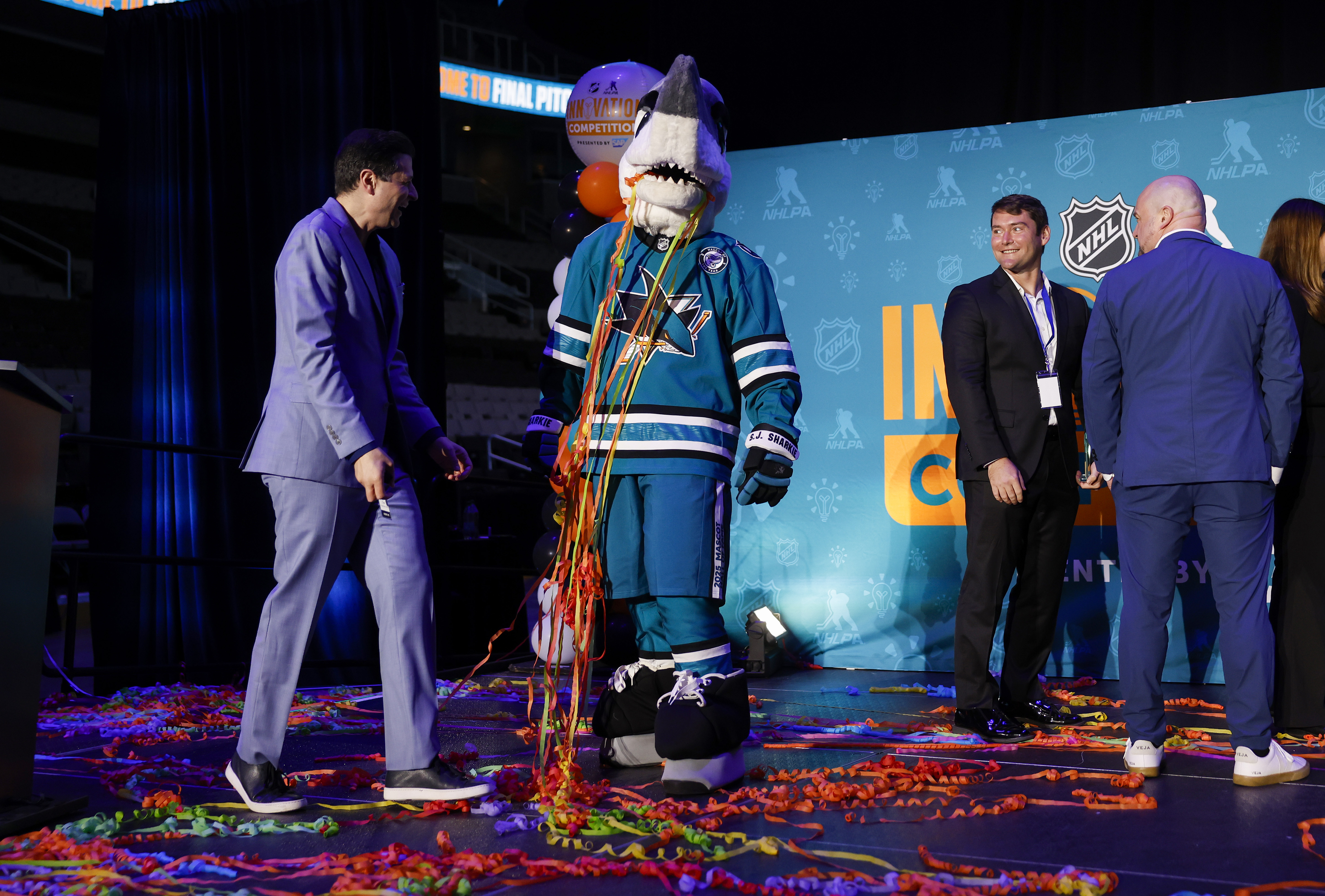 San Jose Sharks mascot S.J. Sharkie jokes around after the...