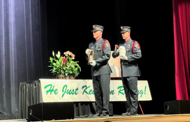Two members of the Santa Clara County Fire Dept. honor guard place two containers with the ashes of Rod Diridon Sr. on a table during his celebration of life at the San Jose Civic Auditorium on Thursday, June 25, 2026. (Sal Pizarro/Bay Area News Group)