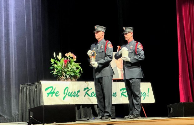 Two members of the Santa Clara County Fire Dept. honor guard place two containers with the ashes of Rod Diridon Sr. on a table during his celebration of life at the San Jose Civic Auditorium on Thursday, June 25, 2026. (Sal Pizarro/Bay Area News Group)