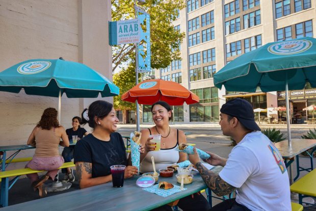 The patio at Reem's California will let customers enjoy its dips and flatbread wraps outside. The cafe featuring Arab street food opens June 26, 2026, in Oakland's Jack London Square. (Photo by Nader Khouri)