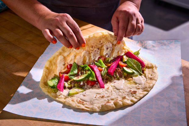 Flatbread wraps are central to the menu at Reem's California, opening on June 26, 2026, in Jack London Square in Oakland. (Photo by Nader Khouri)