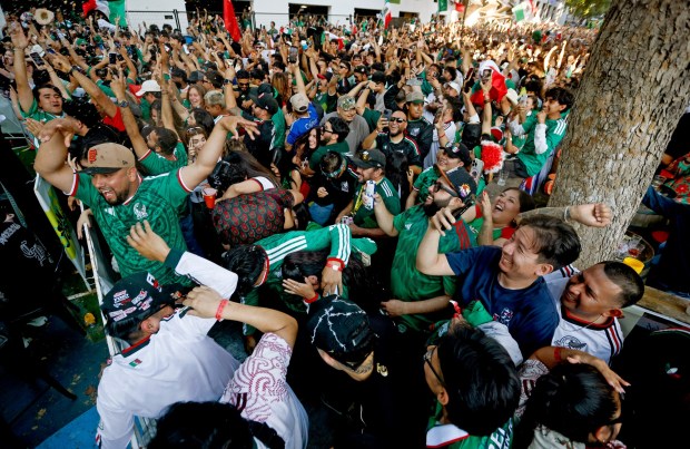 Soccer fans, mostly for Mexico, celebrate a goal by Mexico in the second half of their match against the Korea Republic for the FIFA World Cup at the Soccer Celebration presented by El Camino, hosted by the San Jose Earthquakes and San José Sports Authority at San Pedro Square in downtown San Jose, Calif., on Thursday, June 18, 2026. (Nhat V. Meyer/Bay Area News Group)