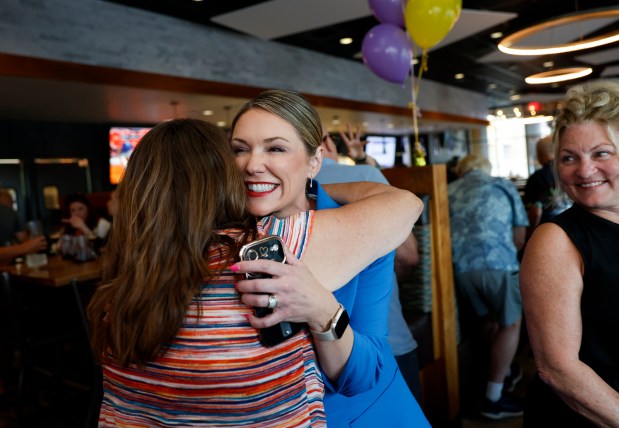 San Jose City Councilmember District 9 candidate Genny Altwer, right, hugs Stephanie Ligsay, a supporter with the Santa Clara County Association of REALTORS, at Altwer's watch party at Jack Holders Restaurant & Bar in San Jose, Calif., on Tuesday, June 2, 2026. (Nhat V. Meyer/Bay Area News Group)