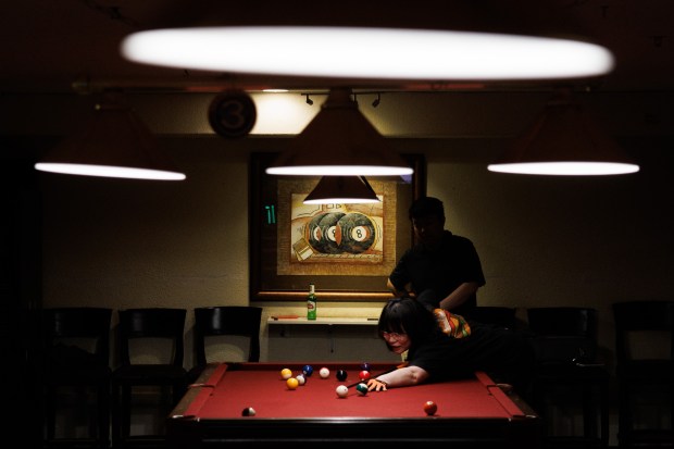 Evelyn Lin, of San Jose, front, and her husband, Nicholas Yin, play pool at Lucky Shot Billiards along historic Murphy Avenue in downtown Sunnyvale on April 3, 2026. (Dai Sugano/Bay Area News Group)
