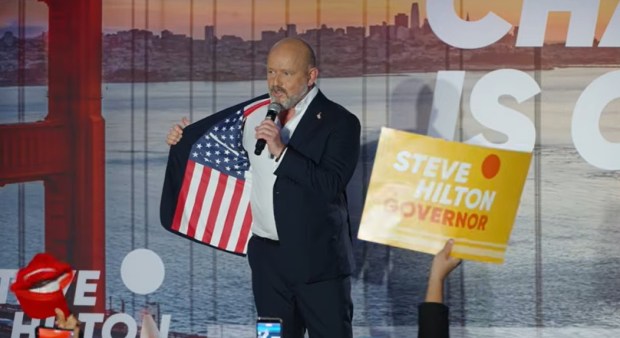 Steve Hilton, a former Fox News commentator and Republican candidate for California governor, shows a crowd of supporters an American-flag embroidered suit jacket during a rally on Tuesday June 2, 2026 in Huntington Beach, Calif. (Photo: Steve Hilton Youtube channel)