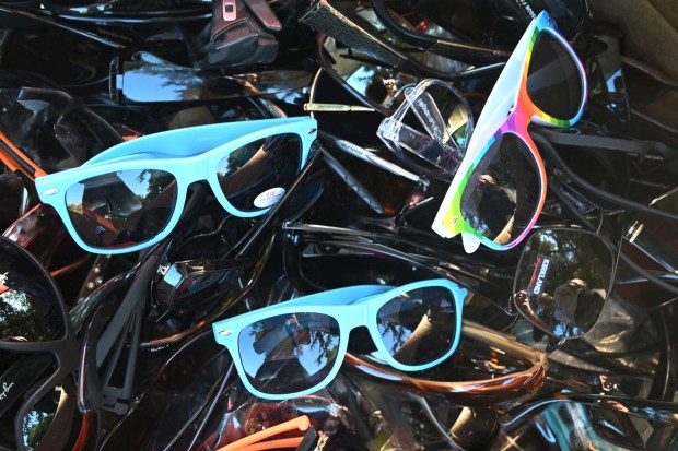 Donated eyeglasses fill a box during a Taco Tuesday collection drive for farmworkers at History Park in San Jose. (J.R. McMinn/Mosaic)