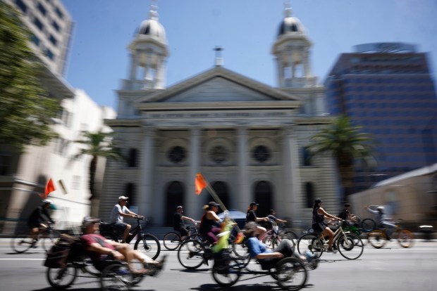 People head south on South Market Street as they ride past Cathedral Basilica of St. Joseph during Viva CalleSJ's "Greetings from San Jose" in downtown San Jose, Calif., on Sunday, June 14, 2026. (Nhat V. Meyer/Bay Area News Group)