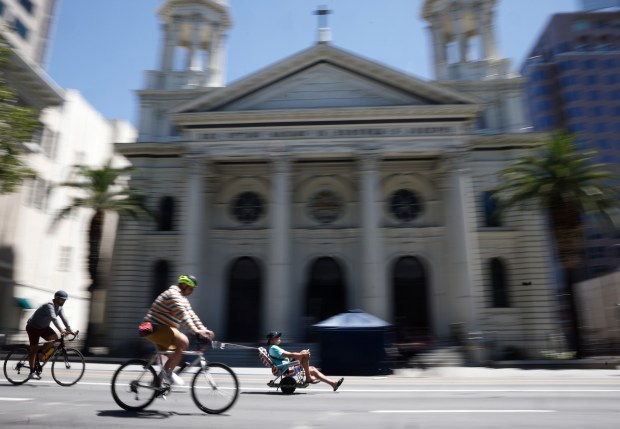 People head south on South Market Street as they ride past Cathedral Basilica of St. Joseph during Viva CalleSJ's "Greetings from San Jose" in downtown San Jose, Calif., on Sunday, June 14, 2026. (Nhat V. Meyer/Bay Area News Group)