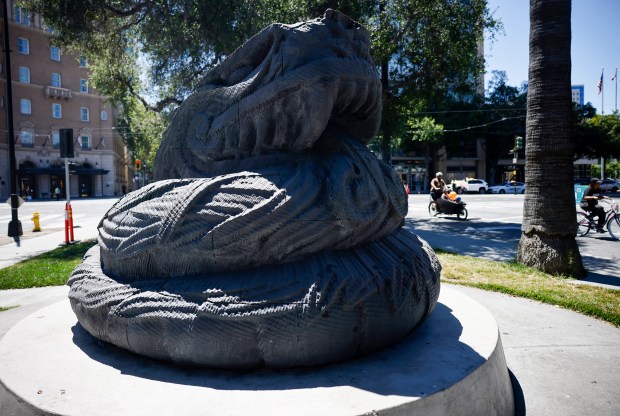 People past the ride past the "Plumed Serpent" by Robert Graham on South Market Street during Viva CalleSJ's "Greetings from San Jose" in downtown San Jose, Calif., on Sunday, June 14, 2026. (Nhat V. Meyer/Bay Area News Group)
