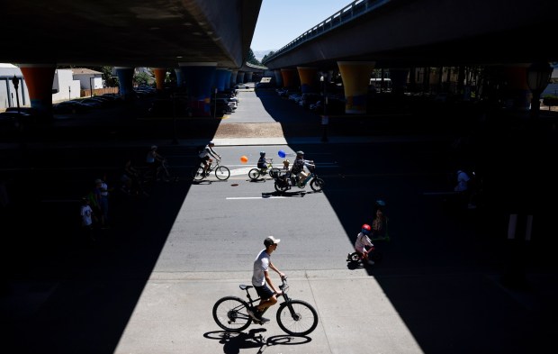 People ride under Interstate 280 on South First Street during Viva CalleSJ's "Greetings from San Jose" in downtown San Jose, Calif., on Sunday, June 14, 2026. (Nhat V. Meyer/Bay Area News Group)
