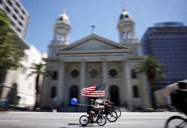 People head south on South Market Street as they ride past Cathedral Basilica of St. Joseph during Viva CalleSJ's "Greetings from San Jose" in downtown San Jose, Calif., on Sunday, June 14, 2026. (Nhat V. Meyer/Bay Area News Group)