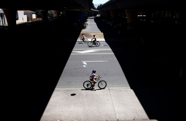 People ride under Interstate 280 on South First Street during Viva CalleSJ's "Greetings from San Jose" in downtown San Jose, Calif., on Sunday, June 14, 2026. (Nhat V. Meyer/Bay Area News Group)