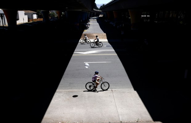 People ride under Interstate 280 on South First Street during Viva CalleSJ's "Greetings from San Jose" in downtown San Jose, Calif., on Sunday, June 14, 2026. (Nhat V. Meyer/Bay Area News Group)