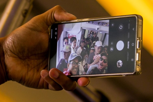 World Cup fans crowded aboard a VTA light rail train for a selfie on the way to Levi's Stadium in Santa Clara for the Switzerland-Qatar match on June 13, 2026. (J.R. McMinn/Mosaic)