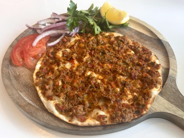 The mini lahmacun, a crispy flatbread with minced lamb and beef and fresh herbs and spices, is pictured in May 2026 at Bodrum Mezze and Cocktails in Dublin, Calif. (John Metcalfe/Bay Area News Group)