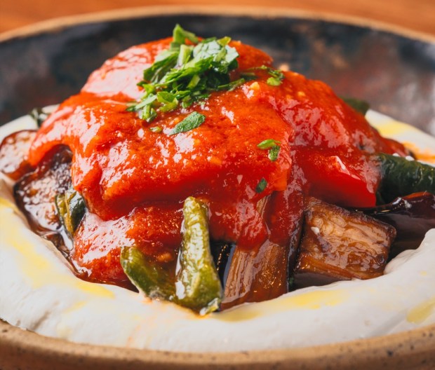 Kopoglu, a dish of fried eggplant, garlicky tomato sauce and yogurt, is served in May 2026 at the Turkish restaurant Meyhouse, which has multiple locations in the San Francisco Bay Area. (Emre Cakir)