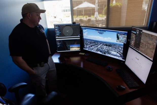 Officer Rusty Johnson, a drone as first responder pilot, at his station at the Chula Vista Police Department on Thursday, May 28, 2026. DFR pilots are able to listen to 911 calls and remotely fly drones from their station. (Kristian Carreon / The San Diego Union-Tribune)
