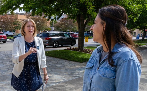 June 2, 2026_San Marcos, CA. California 48th. Congressional District candidate Marni Von Wilpert, left, greets North County voter Mandy Birring at the San Marcos Civic Center. She was more than 100 feet away from the busy polling place at the Civic Center's Community Center (Mandy had voted earlier at a different location). Marni and her campagn manager quickly left for Temecula. Charlie Neuman / For The San Diego Union-Tribune)