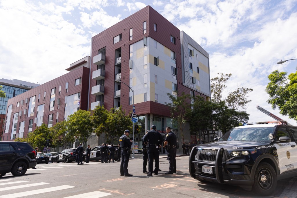 Officer opens fire on barricaded suspect in downtown San Diego