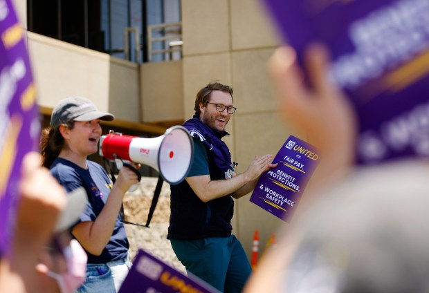 Union leaders Dr. Reice Robinson and Dr, Colin Boehnlein talk with UC San Diego resident, intern and fellowship doctors during a "unity break" demonstration at Hillcrest Medical Center at UC San Diego Health on June 10, 2026 in San Diego, CA. (K.C. Alfred / The San Diego Union-Tribune)