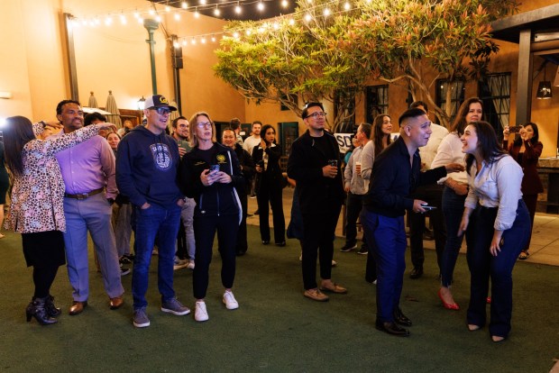 People watch the general election results come in at a Democratic election party at Stone Brewing in Liberty Station on Tuesday, June 2, 2026. (Kristian Carreon / The San Diego Union-Tribune)