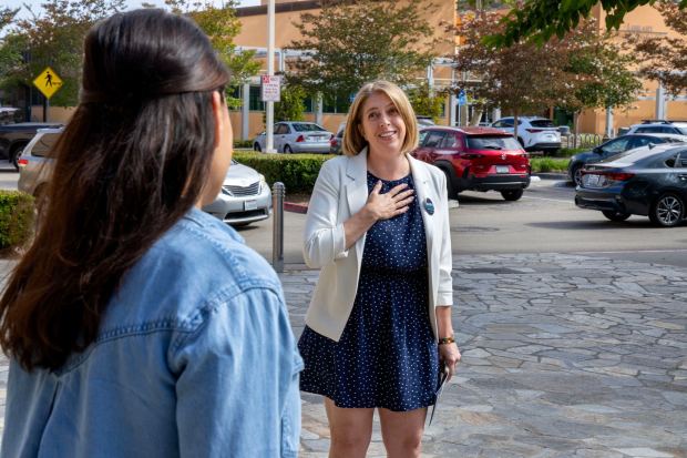 48th Congressional District candidate Marni Von Wilpert, right, greets North County voter Mandy Birring near the San Marcos Civic Center. (Charlie Neuman / For The San Diego Union-Tribune)