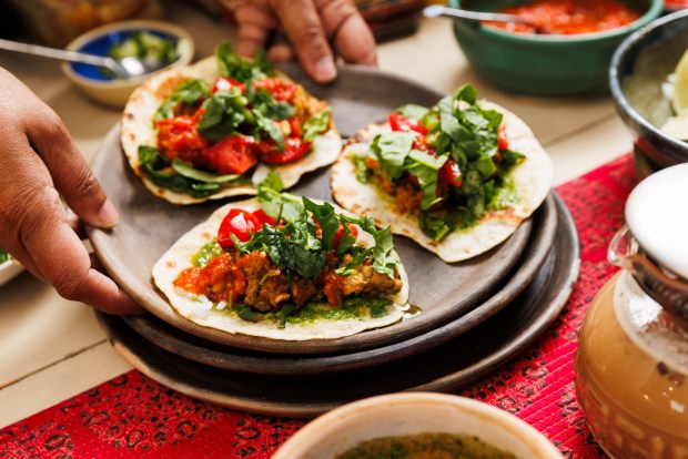 Desi Tacos incorporate ground chicken thighs with Indian spices, chutney and Sonoran-style flour tortillas. (Kristian Carreon / The San Diego Union-Tribune)