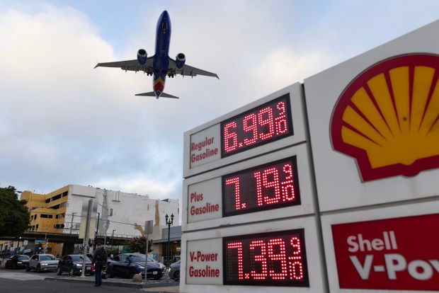 San Diego, CA - A plane flies over Shell gas station on 2521 Pacific Highway on Wednesday, June 10, 2026, in San Diego, CA. (Luke Johnson / The San Diego Union-Tribune)