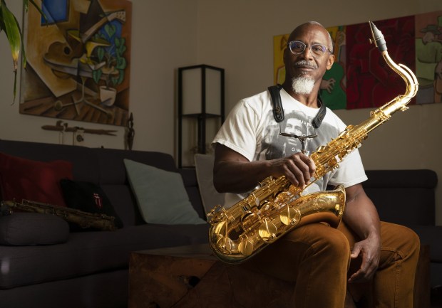 Saxophonist, flutist, and periodic vocalist, who has toured with the Rolling Stones, Karl Denson is celebrating the 25th anniversary of his band, Karl Denson's Tiny Universe this month. Photographed at his home, Feb. 3, 2023. (Howard Lipin / For The San Diego Union-Tribune)