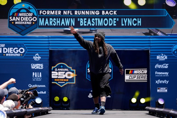 Former NFL running back Marshawn Lynch walks onstage during pre-race ceremonies prior to the NASCAR Cup Series Anduril 250 at Naval Base Coronado on June 21, 2026 in San Diego, California. (Photo by Sean Gardner/Getty Images)